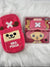 Pink phone case with cartoon character design on a white fluffy surface