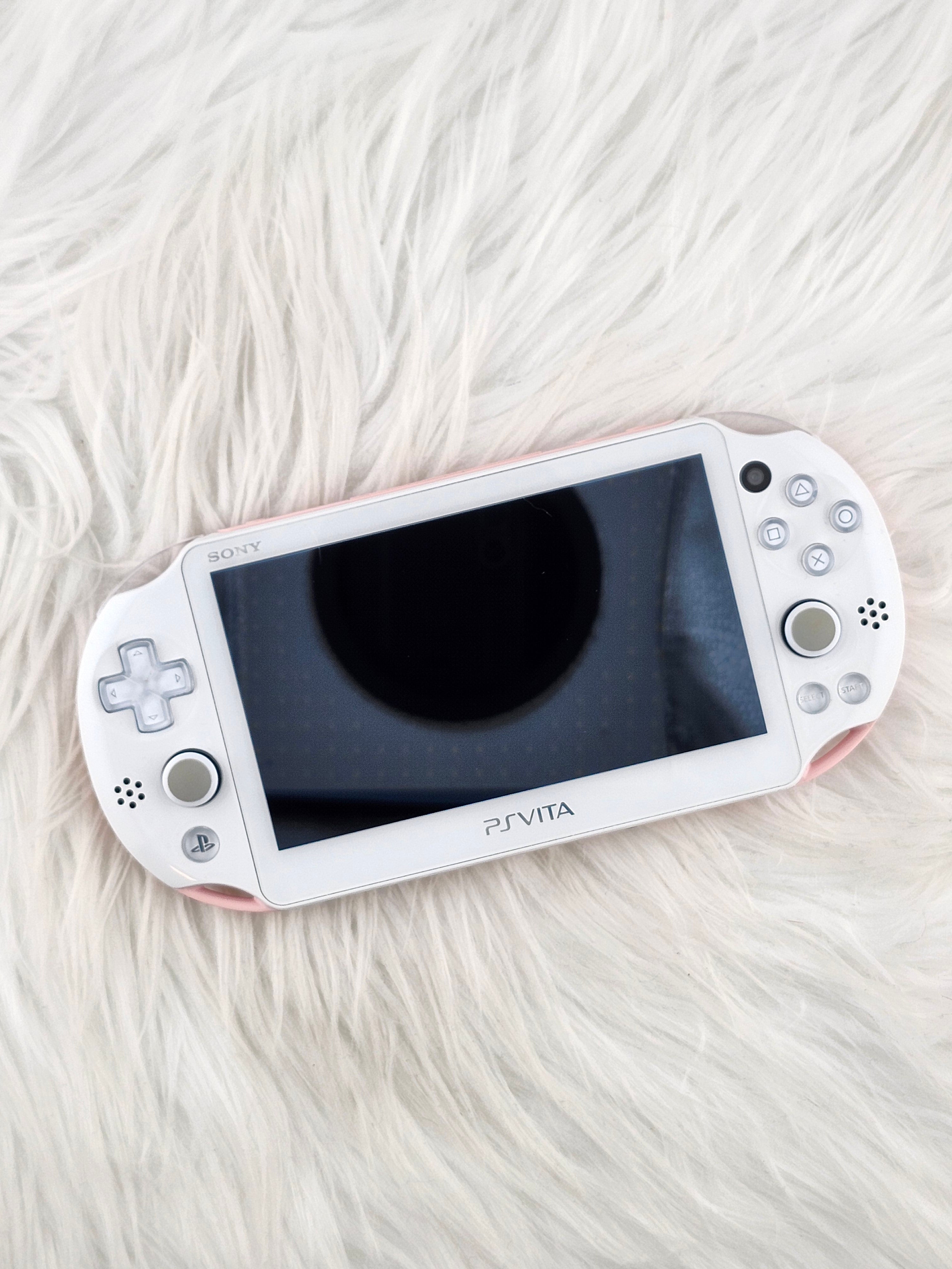 White gaming console on a white fluffy surface