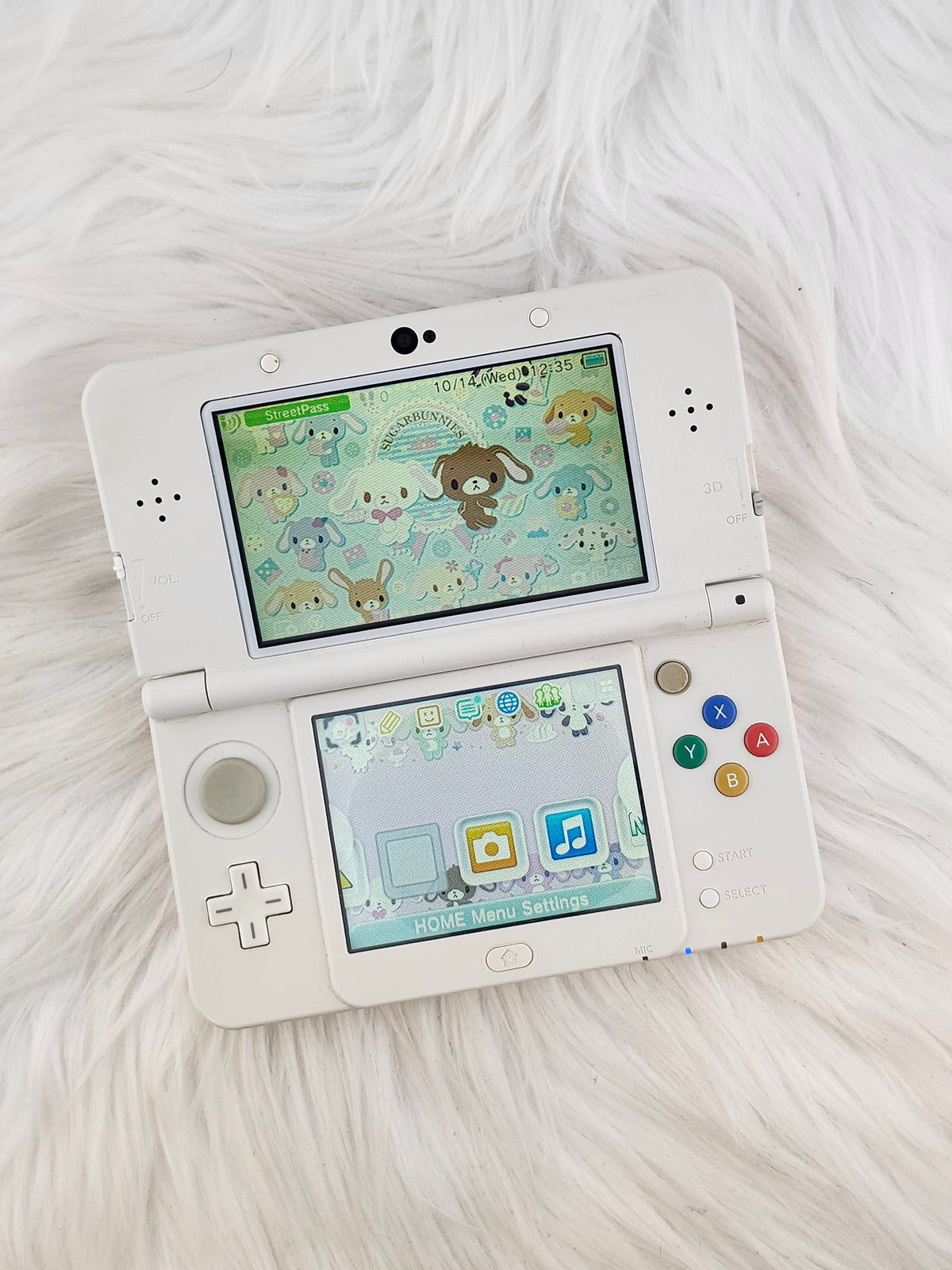 New 3ds con carcasas de rayas rosas y blancas