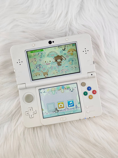 New 3ds con carcasas de rayas rosas y blancas