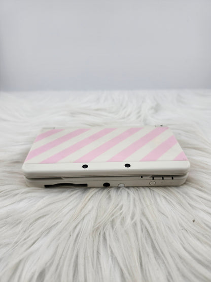New 3ds con carcasas de rayas rosas y blancas
