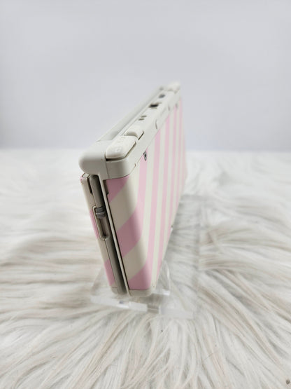 New 3ds con carcasas de rayas rosas y blancas